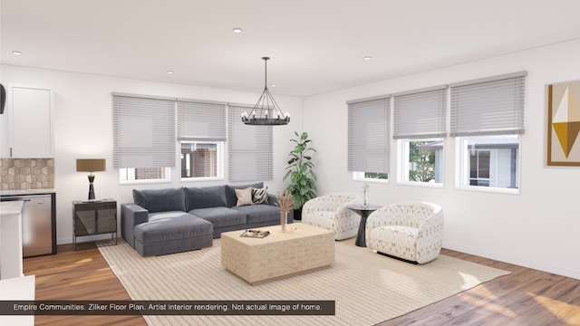 living room with wood-type flooring and a chandelier