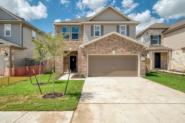 view of front of house with a garage and a front yard