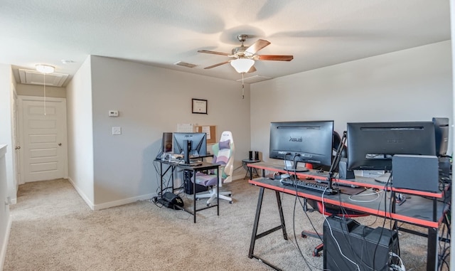 home office with a textured ceiling, light colored carpet, and ceiling fan