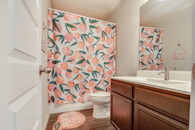 full bathroom with vanity, toilet, hardwood / wood-style flooring, and shower / bath combination with curtain