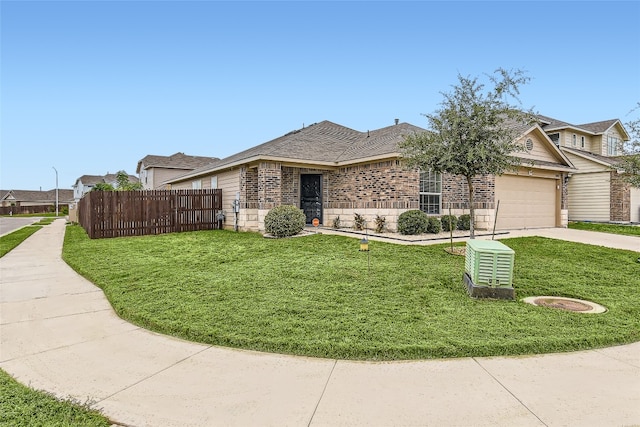 view of front of home with a garage and a front yard