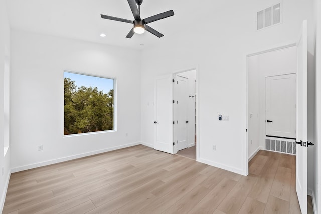 unfurnished bedroom with light hardwood / wood-style flooring and ceiling fan