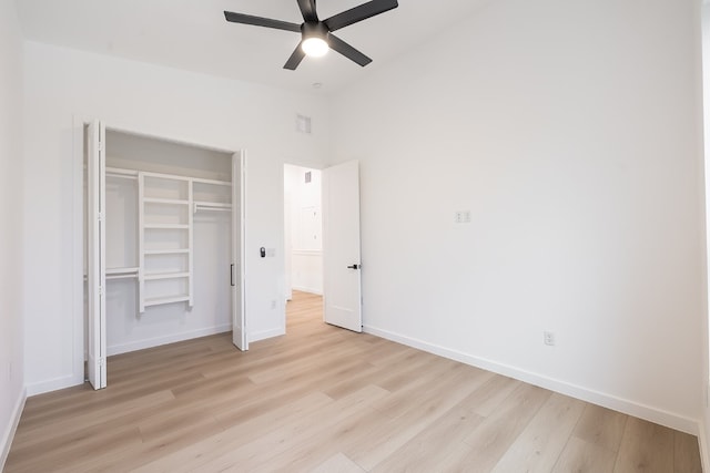 unfurnished bedroom featuring a closet, ceiling fan, and light hardwood / wood-style flooring