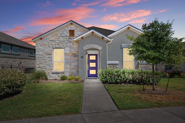 view of front of house with a yard