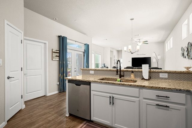 kitchen featuring dishwasher, dark hardwood / wood-style floors, a healthy amount of sunlight, and sink