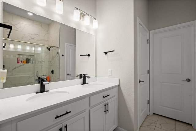 bathroom with vanity and a shower with door