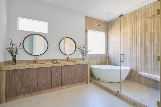 bathroom featuring separate shower and tub, tile patterned flooring, vanity, and tile walls