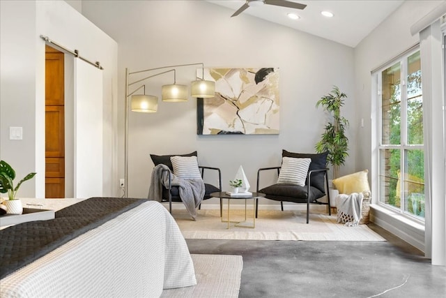 bedroom with ceiling fan, lofted ceiling, and concrete floors