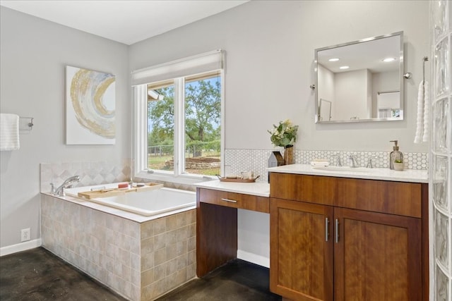 bathroom featuring concrete flooring, vanity, and tiled tub