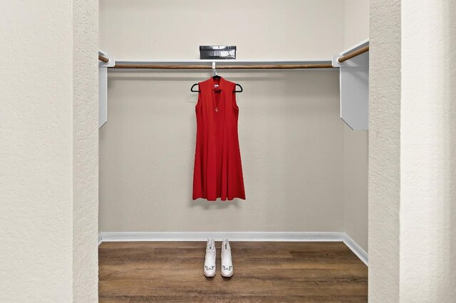 walk in closet featuring hardwood / wood-style floors