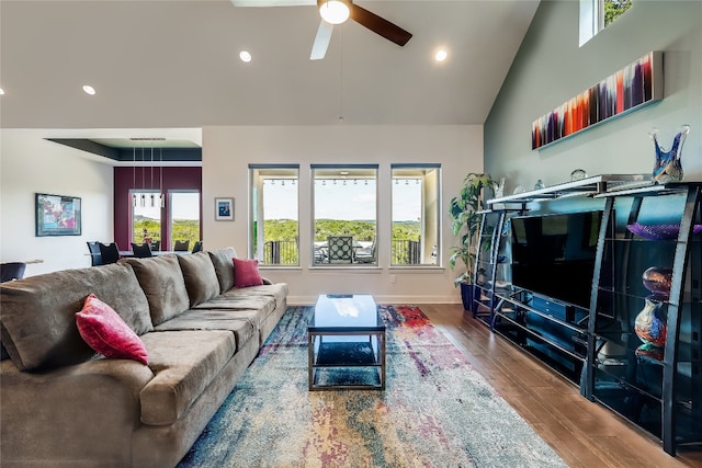 living room with high vaulted ceiling, hardwood / wood-style flooring, and ceiling fan