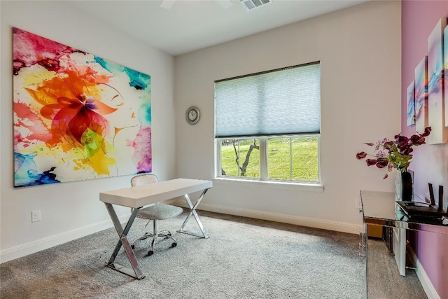 carpeted office with baseboards and visible vents