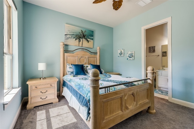 carpeted bedroom featuring connected bathroom and ceiling fan