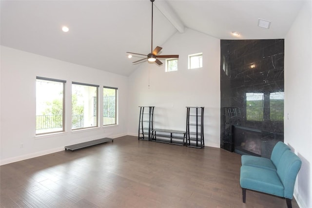 19108 Excursion Falls Way, Jonestown, TX 78645 - living room featuring wood finished floors, high vaulted ceiling, baseboards, beamed ceiling, and ceiling fan