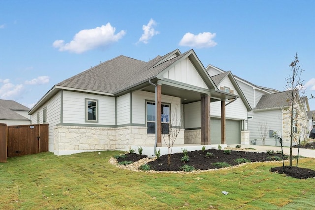 exterior space with a lawn, a porch, and a garage