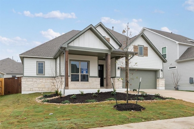 craftsman house with a porch, a garage, and a front yard