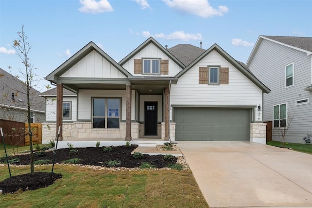 craftsman-style home with a front yard and a garage