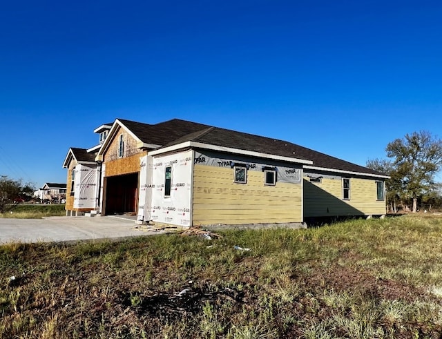 view of property exterior with a garage