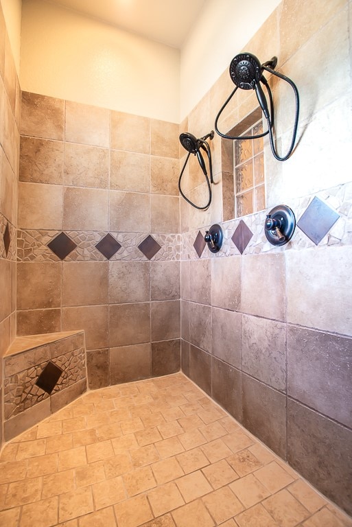 bathroom with a tile shower