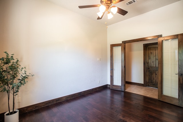 unfurnished bedroom featuring french doors, hardwood / wood-style flooring, and ceiling fan