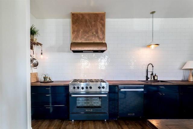 kitchen with hanging light fixtures, wood counters, stainless steel appliances, sink, and dark hardwood / wood-style floors