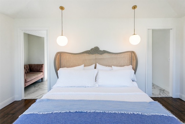 bedroom with dark hardwood / wood-style floors