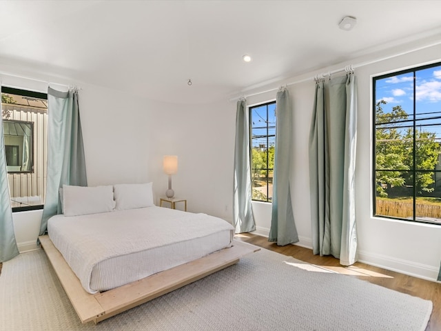 bedroom featuring wood-type flooring