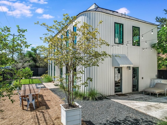 back of property with a patio area