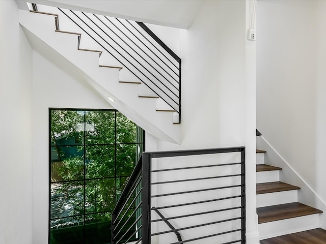 staircase featuring hardwood / wood-style flooring