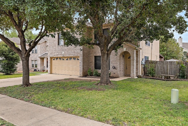 view of front of property with a garage and a front lawn