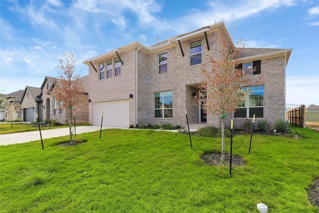 view of front of property featuring a garage and a front yard