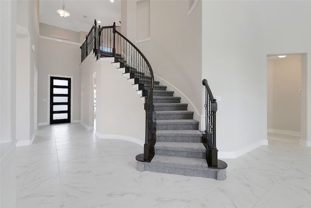 foyer entrance featuring a high ceiling