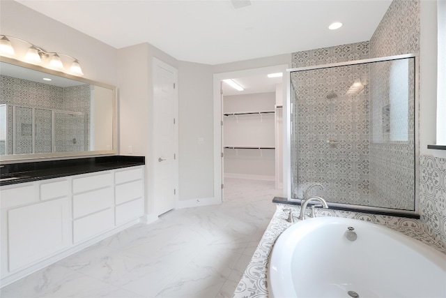 bathroom featuring independent shower and bath and vanity