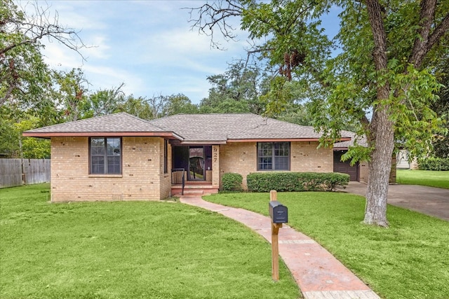 single story home featuring a front lawn