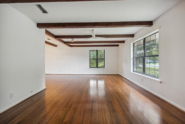 empty room with ceiling fan, beamed ceiling, and hardwood / wood-style floors