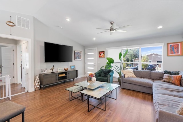 living area with visible vents, wood finished floors, recessed lighting, ceiling fan, and vaulted ceiling