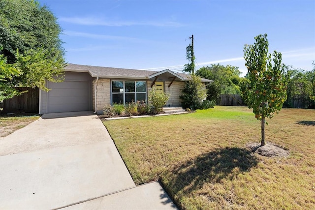 ranch-style house with a garage, fence, driveway, and a front lawn
