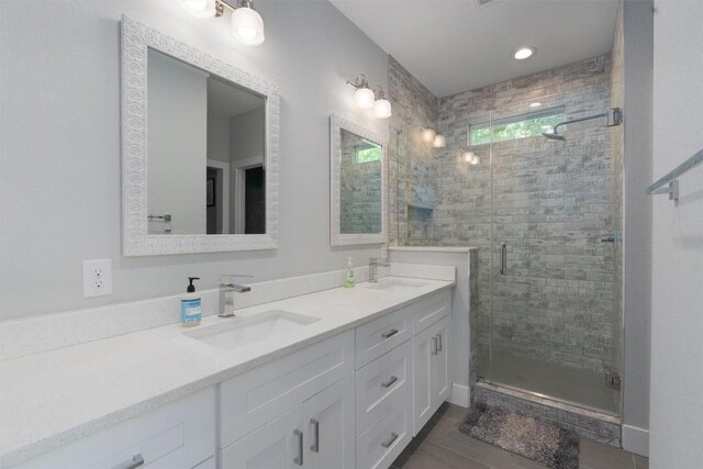 bathroom with vanity and an enclosed shower