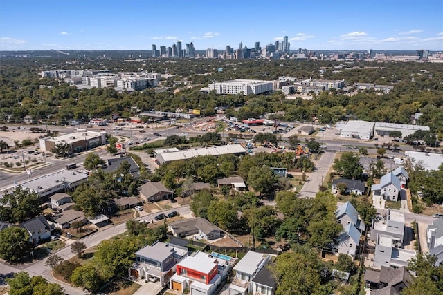 birds eye view of property featuring a city view