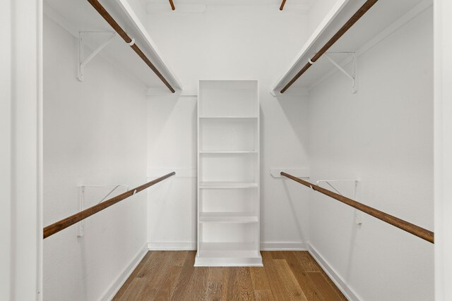 walk in closet featuring light hardwood / wood-style flooring