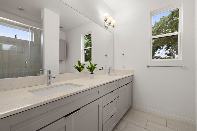 bathroom with vanity and walk in shower