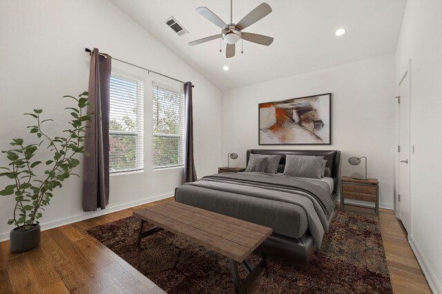 bedroom with lofted ceiling, hardwood / wood-style floors, and ceiling fan