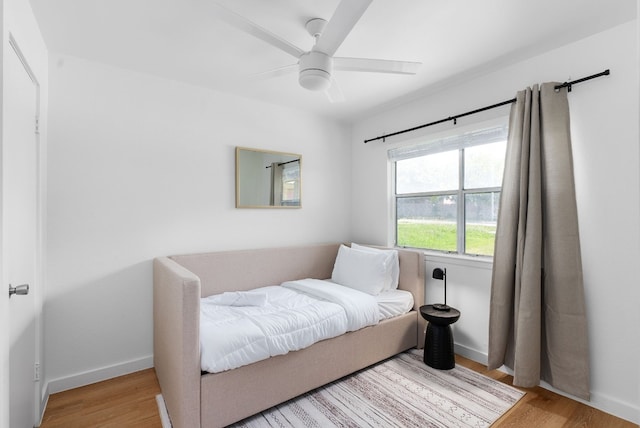 bedroom featuring light hardwood / wood-style flooring and ceiling fan