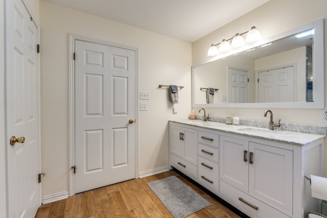 bathroom featuring vanity and wood-type flooring