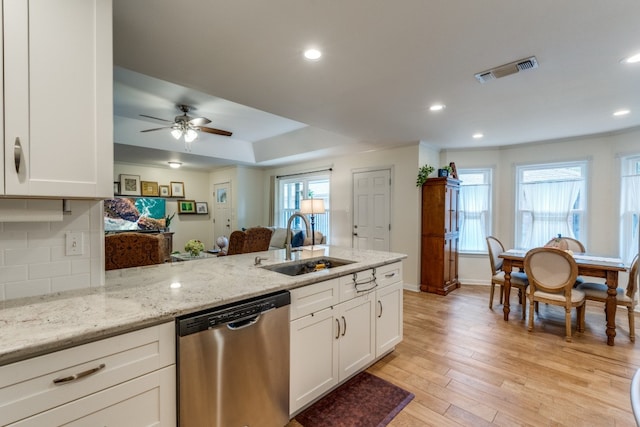 kitchen with dishwasher, light hardwood / wood-style floors, sink, white cabinetry, and ceiling fan