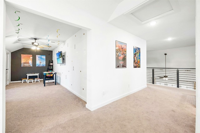 corridor featuring lofted ceiling and carpet floors