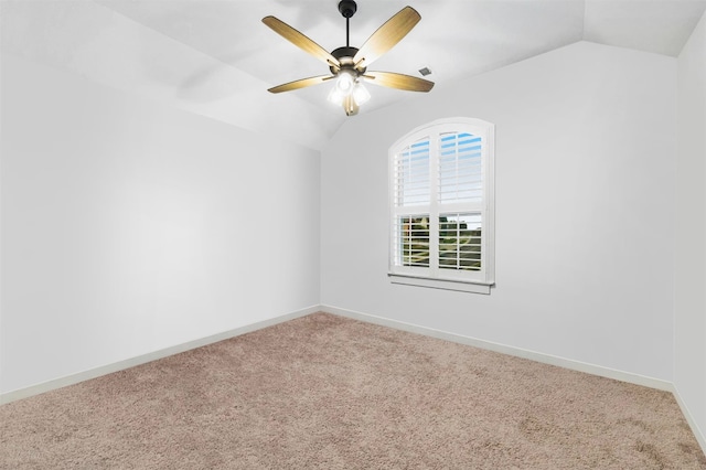 unfurnished room with lofted ceiling, ceiling fan, and carpet