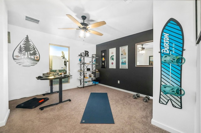 exercise area with carpet flooring and ceiling fan