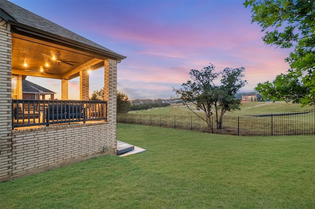 view of yard at dusk