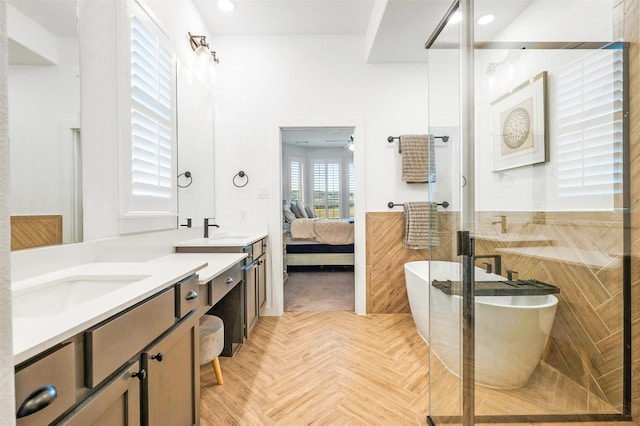 bathroom with vanity, parquet floors, and separate shower and tub